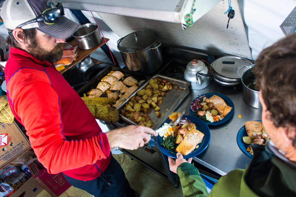 ALE guide Chris N. serves up dinner in base camp