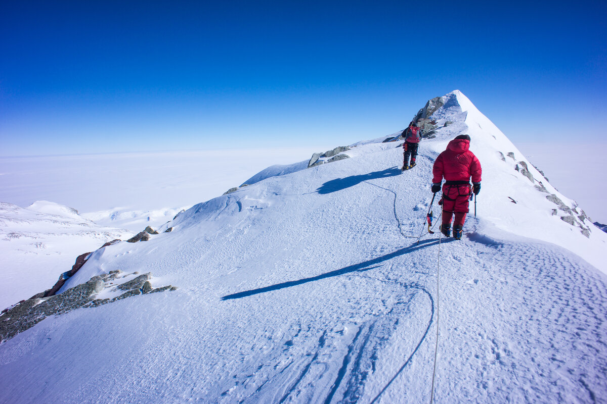 Roped climbers approach the summit of Mount Vinson