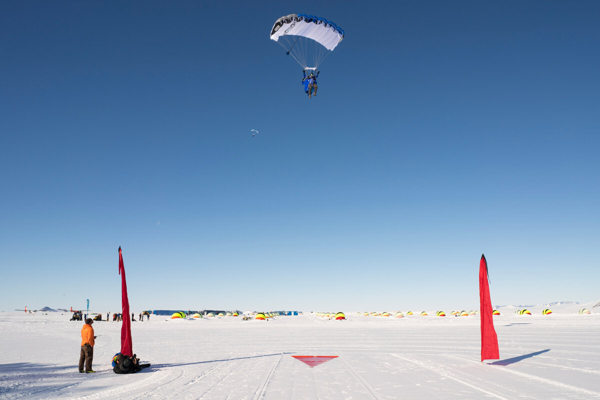 A skydiver comes in to the landing zone at Union Glacier