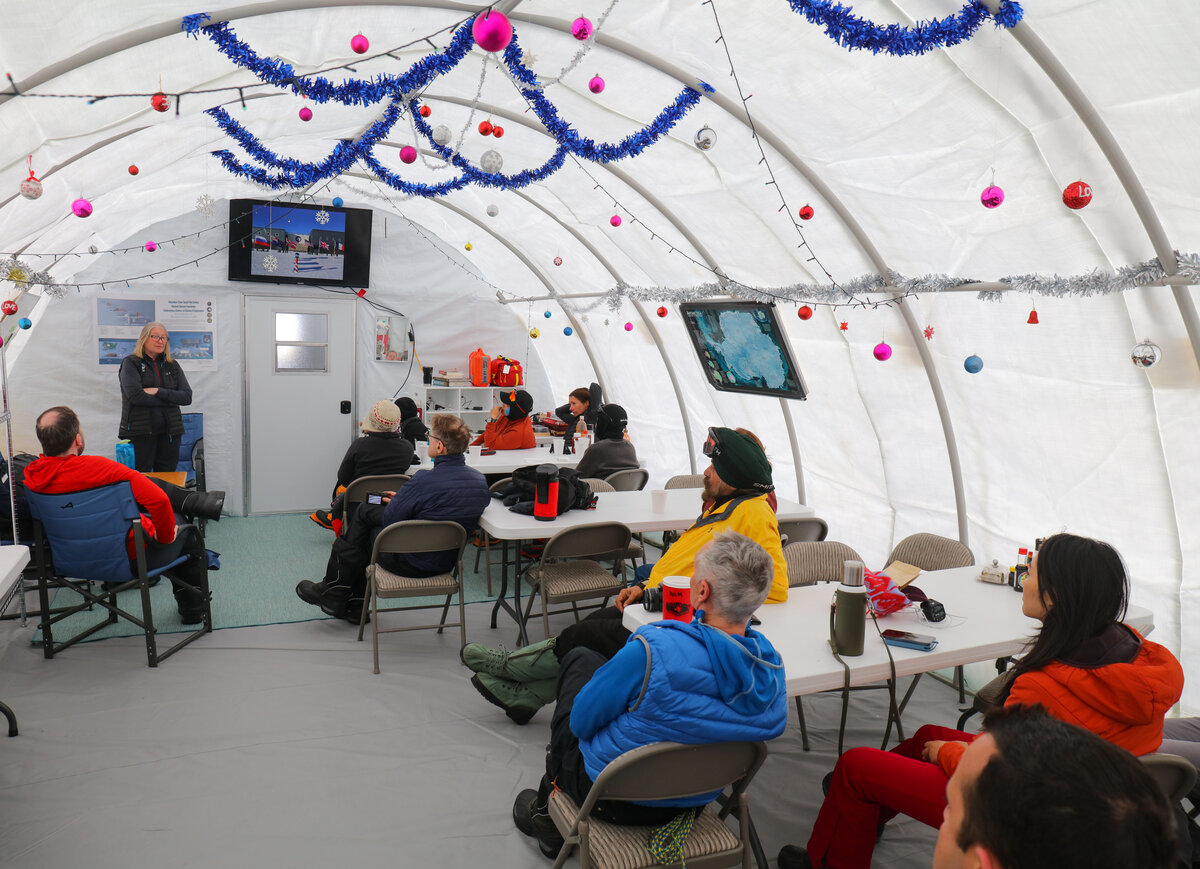Carol K. gives a lecture to guests at ALE's South Pole Camp